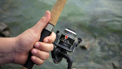 Close-up of man holding camera