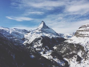 Idyllic shot of snowcapped mountains against sky