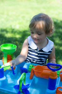 Cute boy playing with toy