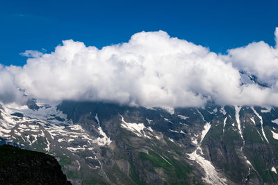 Panoramic view of landscape against blue sky