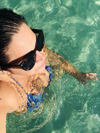 High angle view of woman swimming in pool 