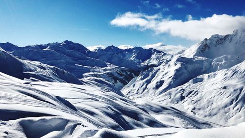 Scenic view of snowcapped mountains against sky