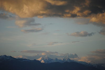 Scenic view of mountains against dramatic sky