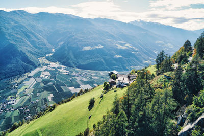 Aerial view of agricultural field by mountains