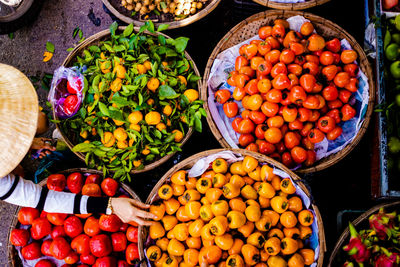 High angle view of fruits in basket at market stall