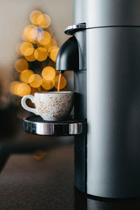 Preparing espresso with a coffee machine. process of pouring coffee at cup. cup of coffee close-up