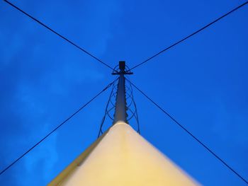 Low angle view of cables against blue sky