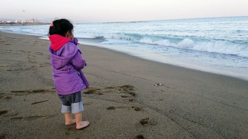 Rear view of woman on beach