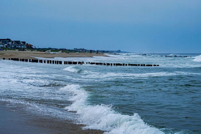 Scenic view of sea against clear blue sky