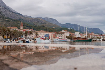 Scenic view of sea and mountains against sky