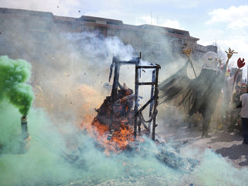 Panoramic view of people on fire