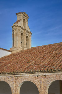 Low angle view of historical building against blue sky