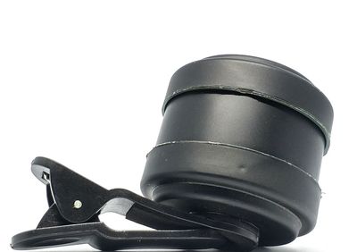 Close-up of camera against white background