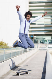 Full length of young man jumping