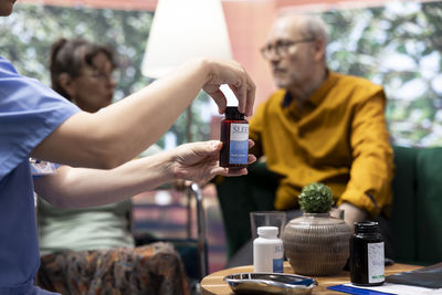 Midsection of man preparing food at table