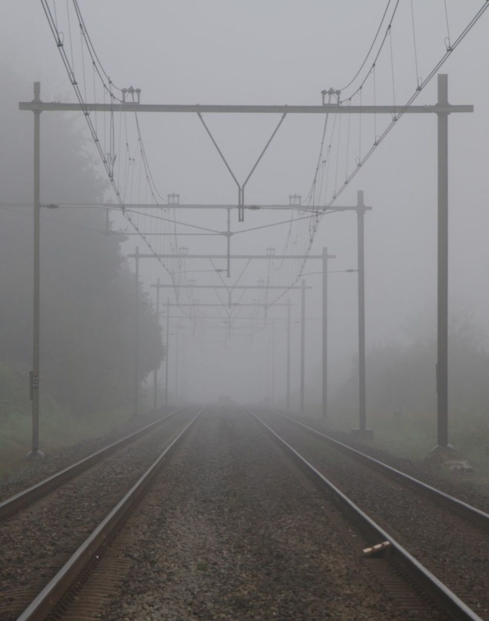 RAILWAY TRACKS IN FOGGY WEATHER