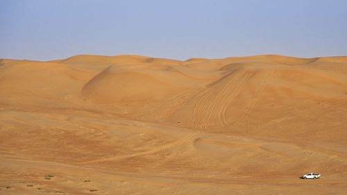 Scenic view of desert against clear sky
