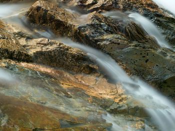 Close-up of water flowing through rocks