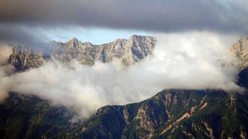 Panoramic view of snowcapped mountains against sky