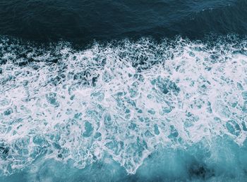 High angle view of water splashing in sea