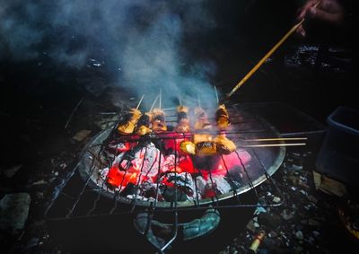 Panoramic shot of fire on barbecue grill