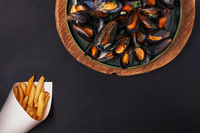 High angle view of woman holding pumpkin
