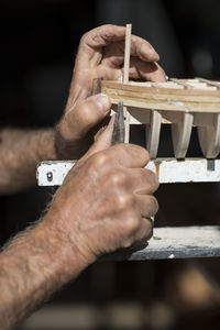 Close-up of man working on wood