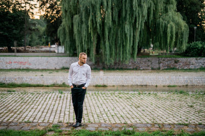 Full length of man standing on grassland