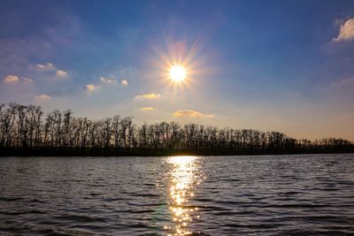 Scenic view of lake against sky during sunset