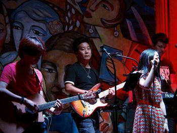 Group of people playing guitar