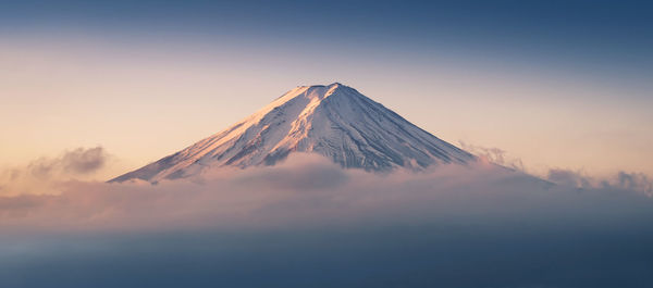 Scenic view of mountain against sky during sunset