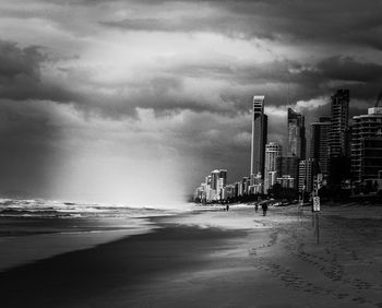 Scenic view of beach against sky in city
