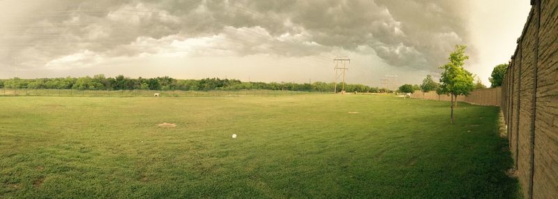 Scenic view of landscape against cloudy sky