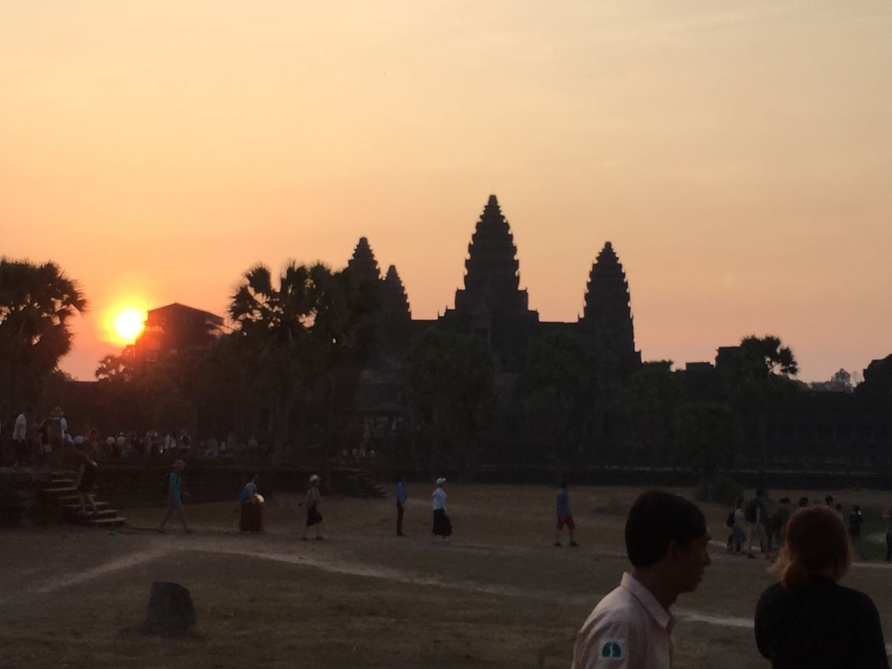 PEOPLE AT TEMPLE AGAINST SKY