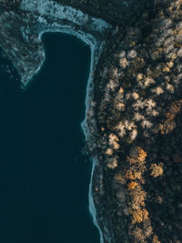 Low angle view of rock formation in sea against sky