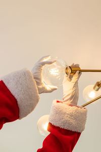 Close-up of santa hat against pink background