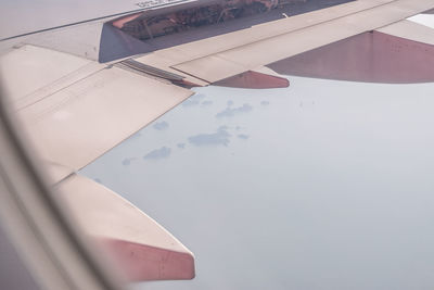 High angle view of airplane flying in sky