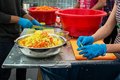 People working with food on table