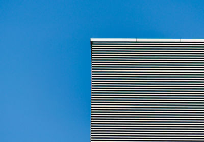 Low angle view of building against clear blue sky