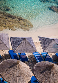 High angle view of chairs on beach