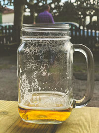 Close-up of beer glass on table