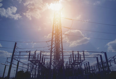 Low angle view of electricity pylon against sky