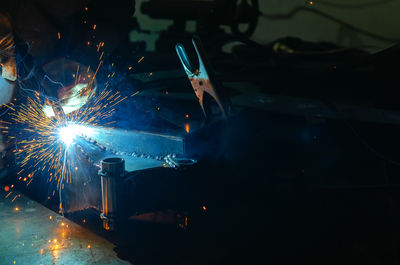 People welding in factory