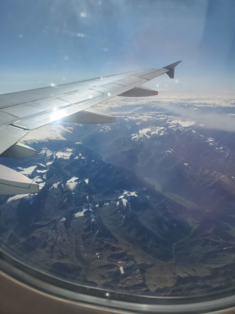 AERIAL VIEW OF MOUNTAINS AND SKY