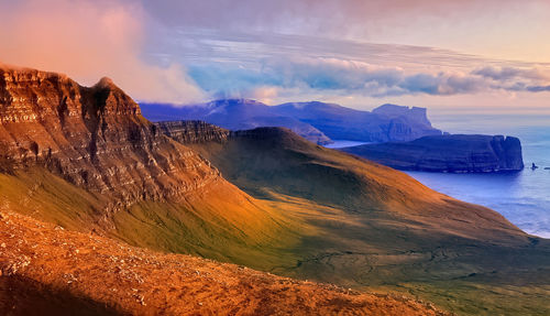 Panoramic view of the sea in the mountains. nordic islands,greenland,faroer,iceland with sunset