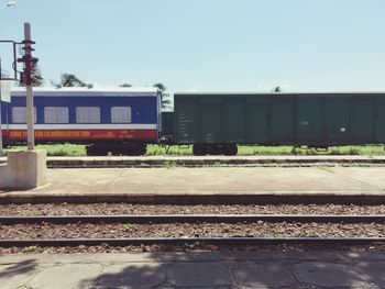 Train on railroad track against sky