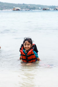 Portrait of boy in sea