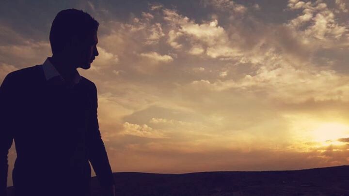 silhouette, sunset, sky, lifestyles, cloud - sky, standing, beauty in nature, tranquility, leisure activity, scenics, tranquil scene, men, nature, landscape, cloud, rear view, mountain, three quarter length