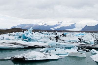 Scenic view of frozen lake against sky
