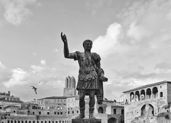 Low angle view of statue against building